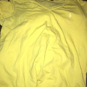 yellow polo shirt .